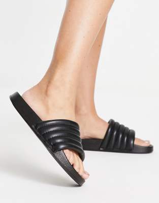 slay flat sandals in black