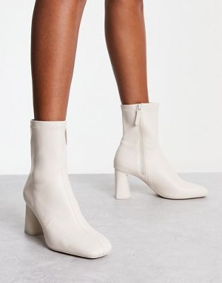 mid heel sock boot in white