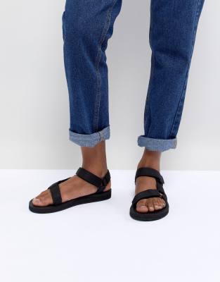 teva black original universal flat sandals