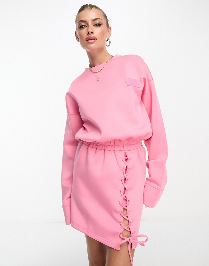 The Couture Club mini jumper dress with lace up detail in pink
