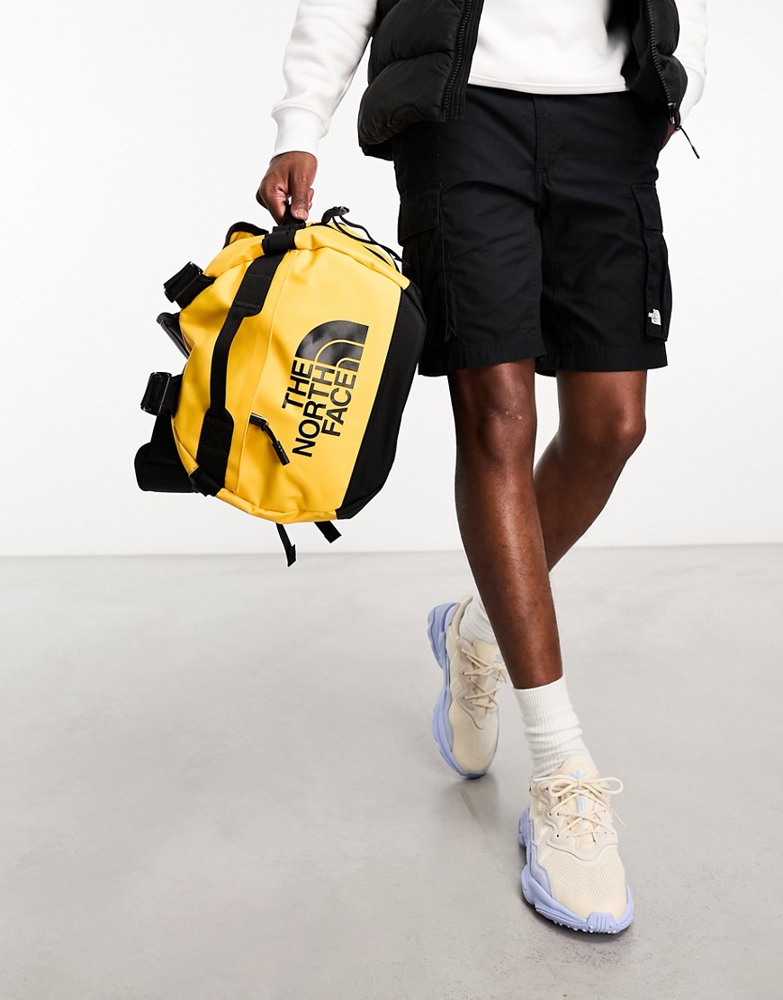 The North Face Base Camp small 50l duffel bag in yellow and black