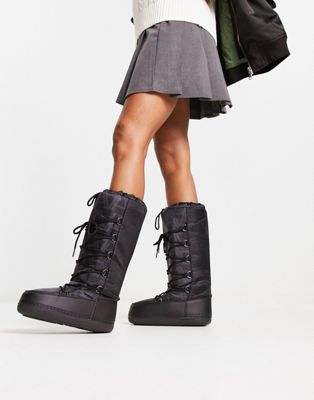 high leg snow boots in black mono print