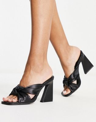 knot front heeled mules in black