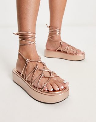 Truffle Collection knotted strappy tie leg sandals in rose gold