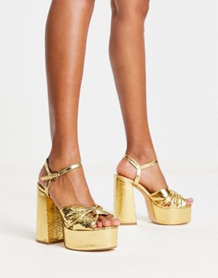 mega platform sandals in gold