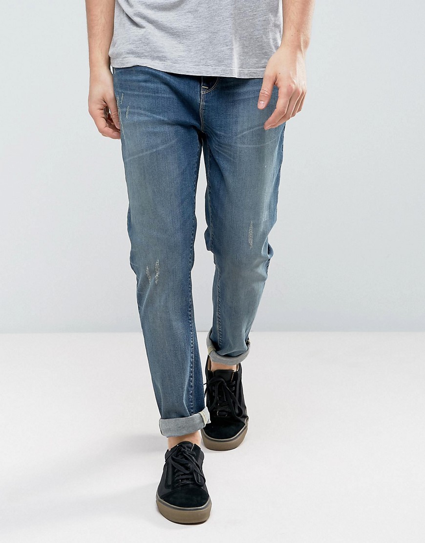 фото Умеренно выбеленные суженные книзу джинсы asos-синий asos design
