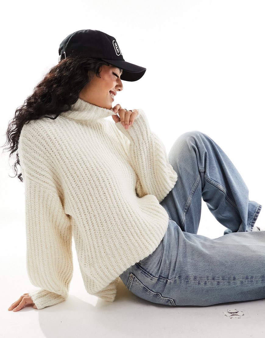 Vero Moda high neck long sleeve knitted jumper in cream-White