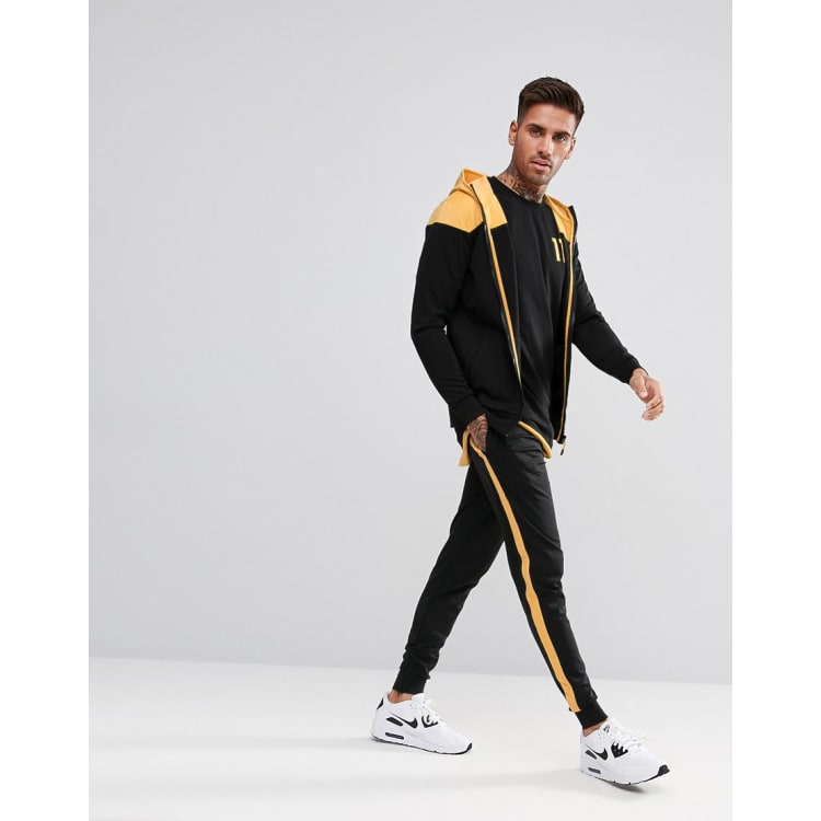 Yellow joggers cheap black stripe