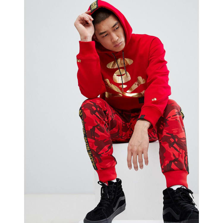 AAPE By A Bathing Ape Track Suit with Taping In Red | ASOS