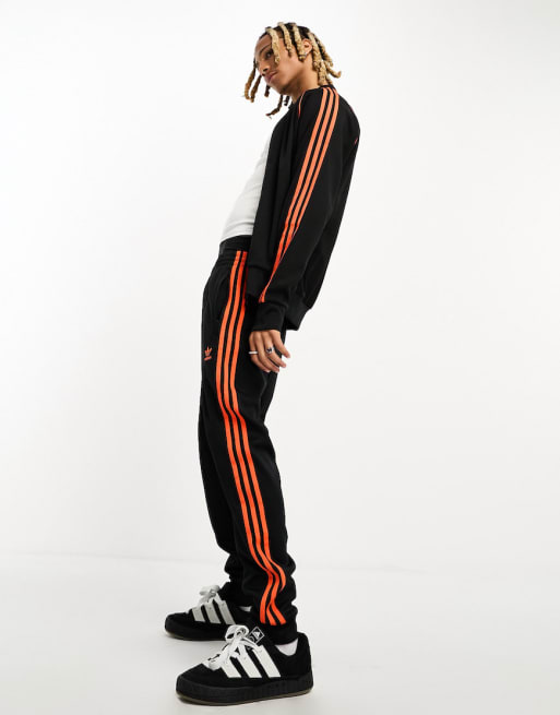 Orange and black adidas tracksuit hotsell