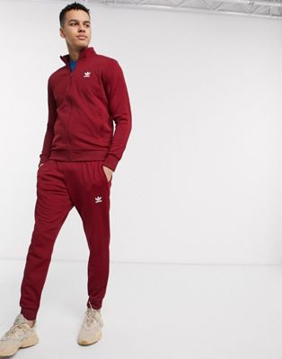 adidas Originals essentials tracksuit with trefoil logo in burgundy | ASOS