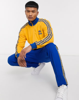 navy blue and yellow adidas tracksuit