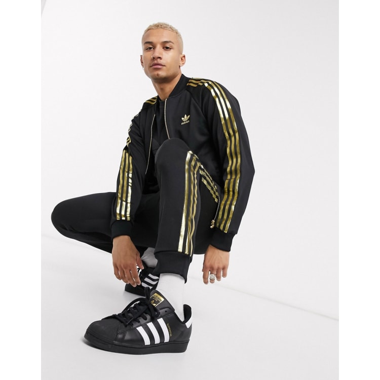 Gold sales adidas tracksuit