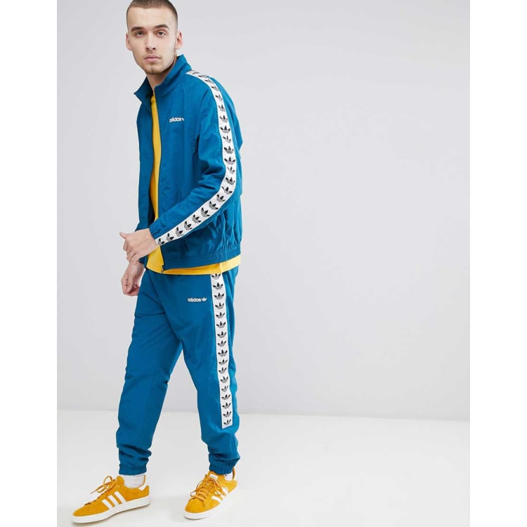 adidas originals vintage joggers with taped side stripe in blue ce4824