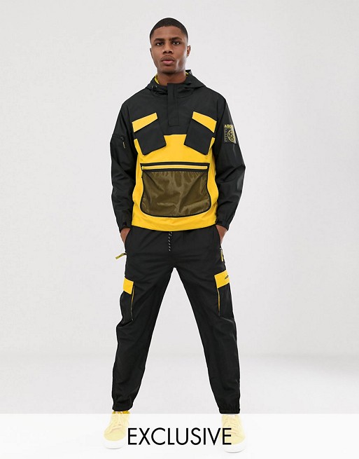 Agora tracksuit in black with utility pockets