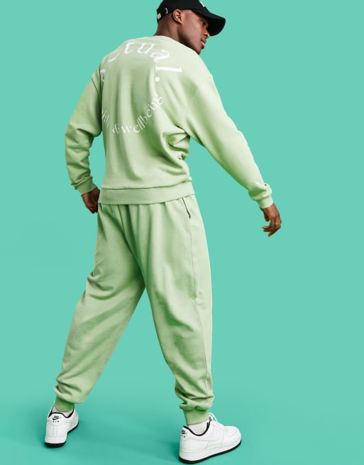 ASOS Actual Athleisure relaxed joggers in green with health and wellbeing logo print