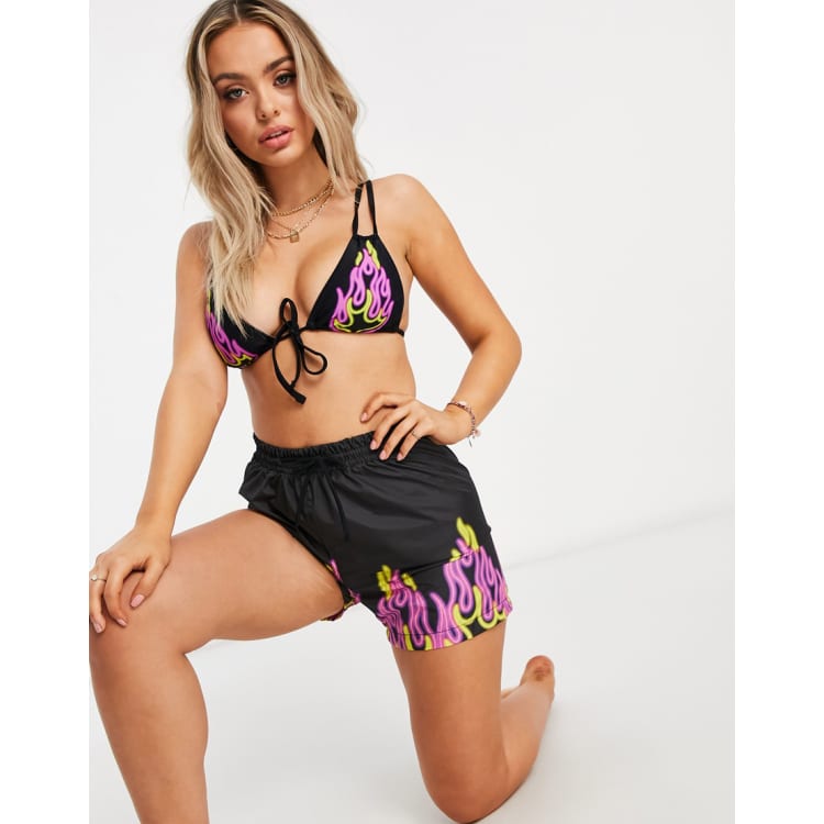 ASOS DESIGN bikini and board shorts in multi neon flame print