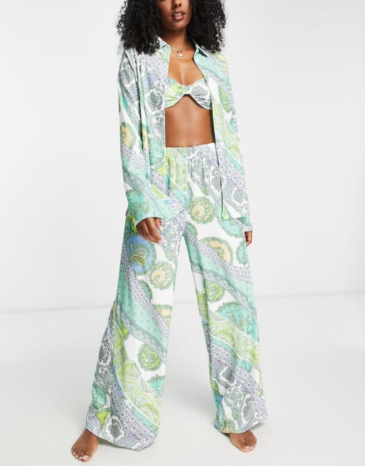 ASOS DESIGN - Coordinato con camicia oversize in jersey, micro top reggiseno e pantaloni con fondo ampio