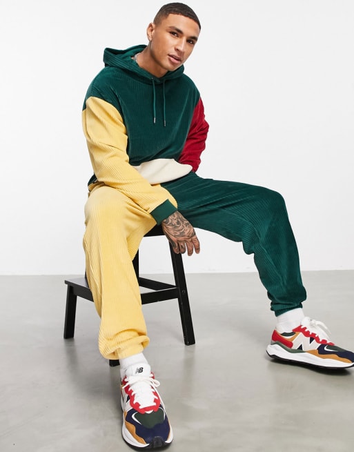ASOS DESIGN - Coordinato con felpa con cappuccio e joggers oversize in velour a coste color block