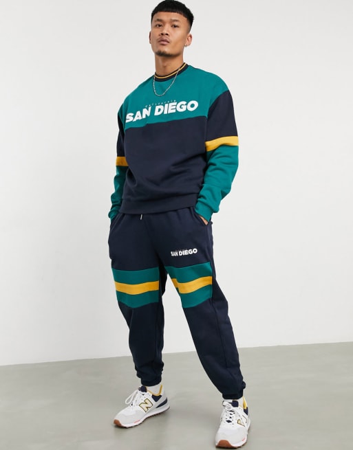 ASOS DESIGN - Oversized trainingspak met San Diego-print in marineblauw, co-ord set