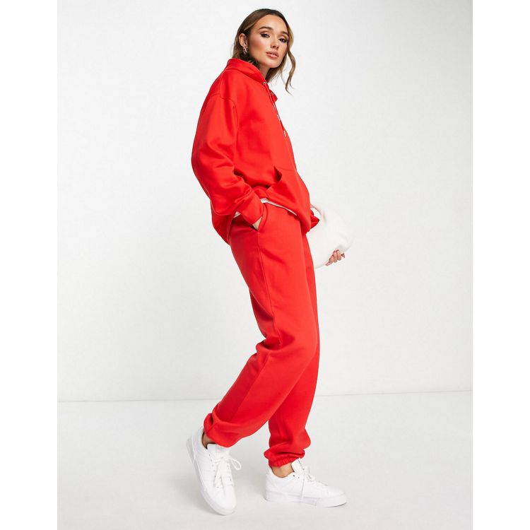 ASOS DESIGN roll waist oversized sweatpants with tennis logo in red