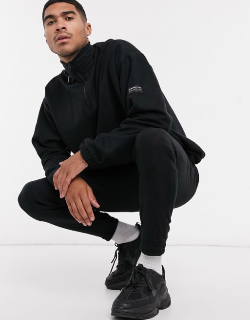 ASOS DESIGN – Schwarzer Trainingsanzug aus Polarfleece
