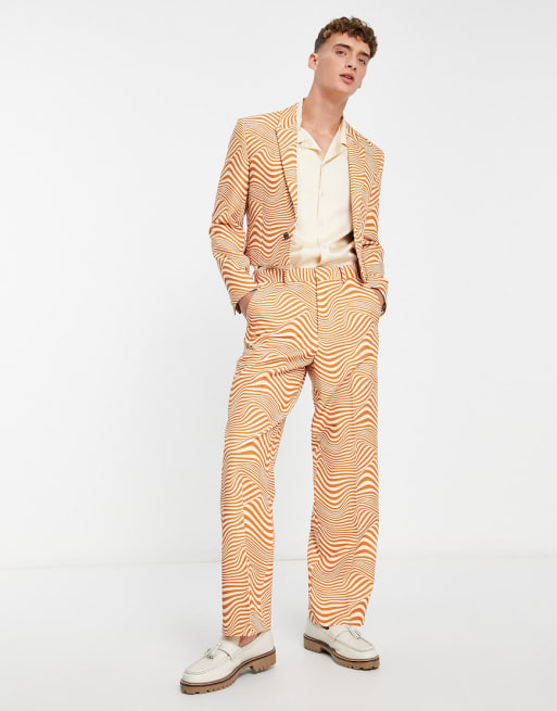 ASOS DESIGN wide leg suit pants in black and orange swirl print