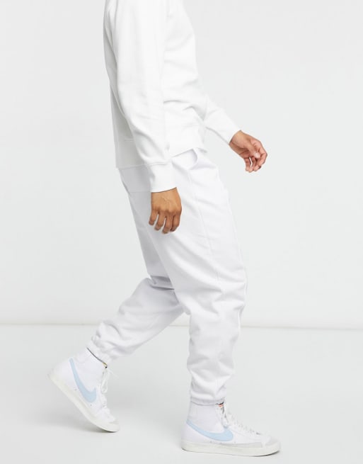 ASOS DESIGN - Tuta sportiva oversize con pinces cucite colore bianco in coordinato