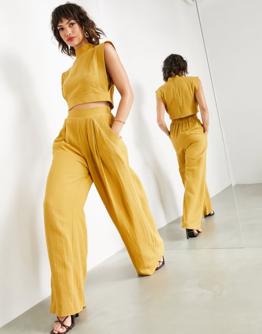 ASOS EDITION – Zestaw w kolorze musztardowym z ozdobnymi przeszyciami: top i spodnie z szerokimi nogawkami