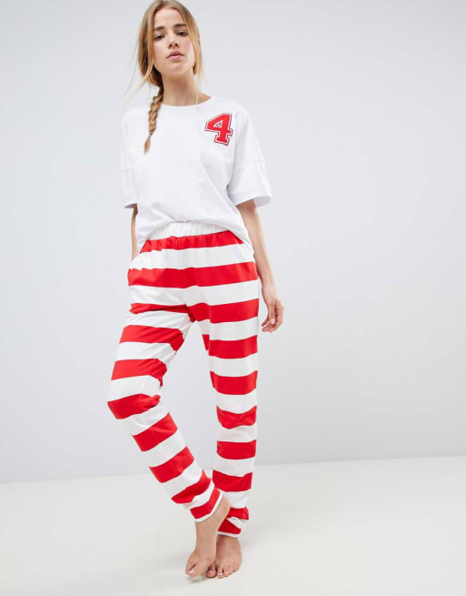 ASOS – T-Shirt mit College-Applikation und Jogginghose im Set
