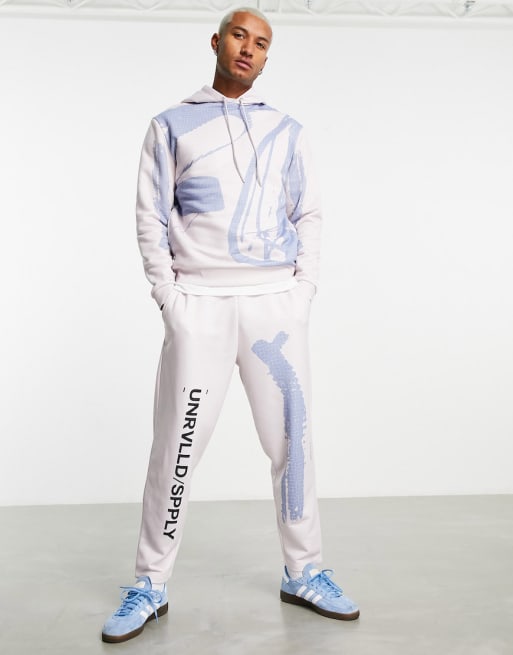 ASOS Unrvlld Spply co ord with abstarct graphic & logo prints in beige
