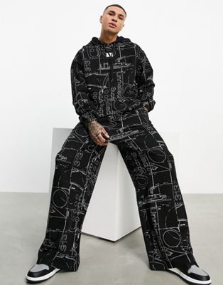 ASOS Unrvlld Spply co-ord wide leg joggers with all over graphic print in black