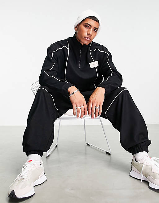 ASOS Unrvlld Spply oversized with piping & logo badge
