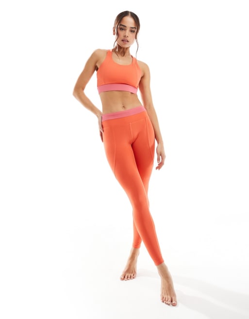 Born Living Yoga - Navani - Brassière de sport réversible et legging - Corail