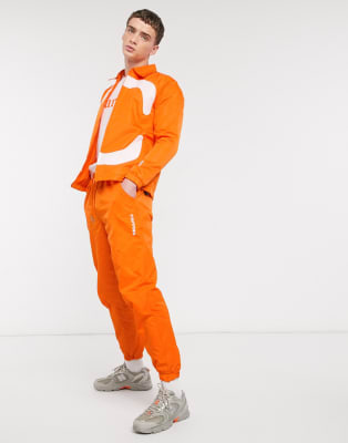 orange track suit