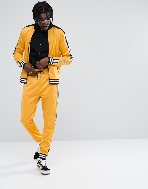 Chándal naranja con raya deportiva de Jaded London