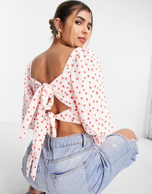 Collective The Label - Exclusivité - Ensemble avec crop top noué au dos et mini-jupe froncée à volants