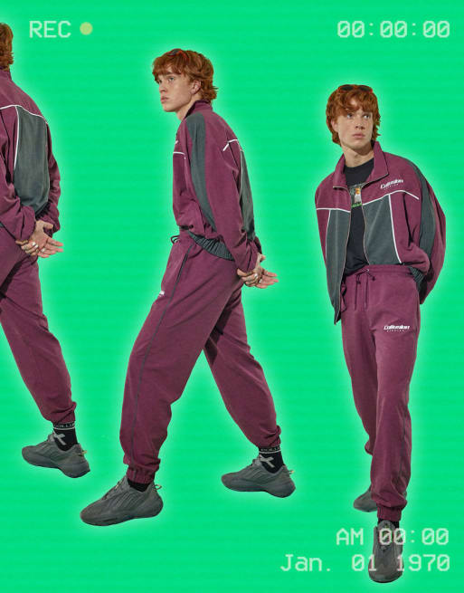 COLLUSION Unisex - Coordinato tuta sportiva con giacca e joggers in tessuto morbido color viola prugna