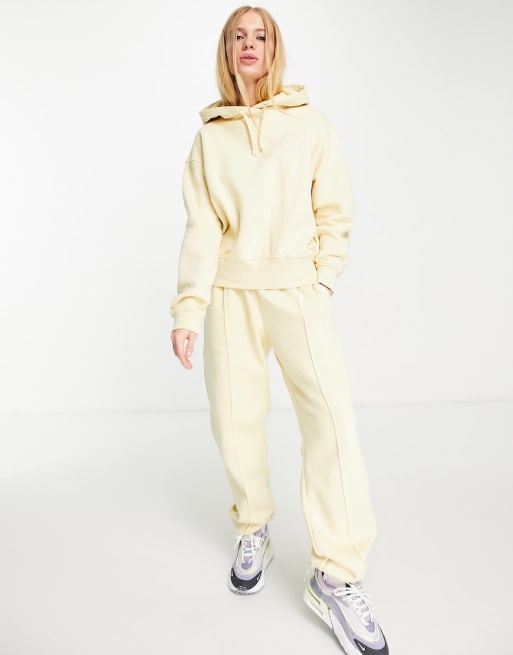 Conjunto amarillo limón con logo pequeño Clear the Mind de Nike