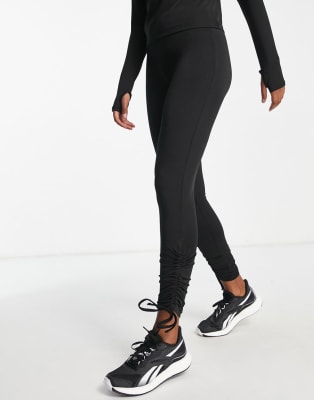 Conjunto deportivo negro con laterales fruncidos con lazada de Threadbare Fitness