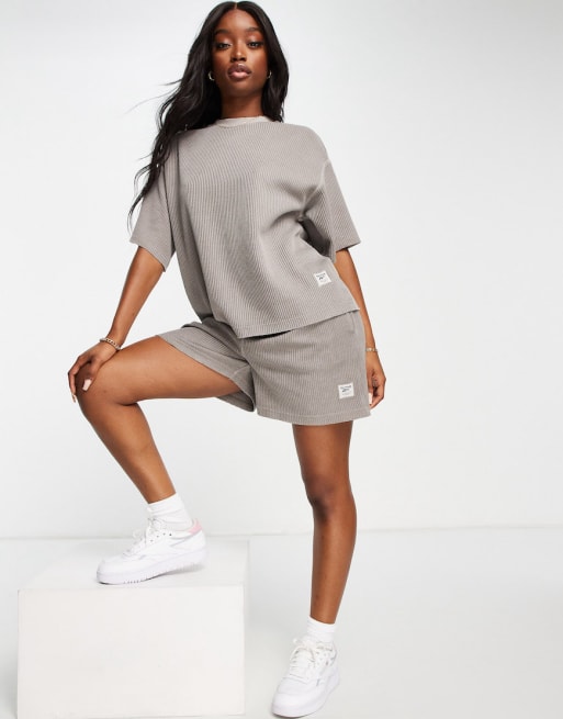 Conjunto gris roca de punto de arroz de Reebok