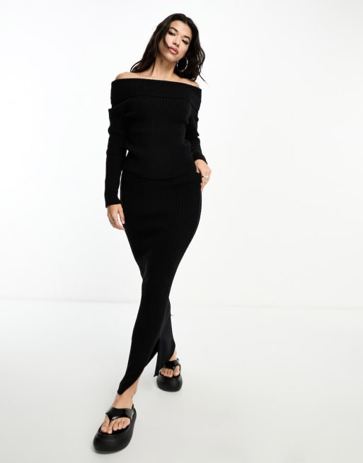 Conjunto negro de jersey con escote Bardot y falda midi de punto de Kaiia