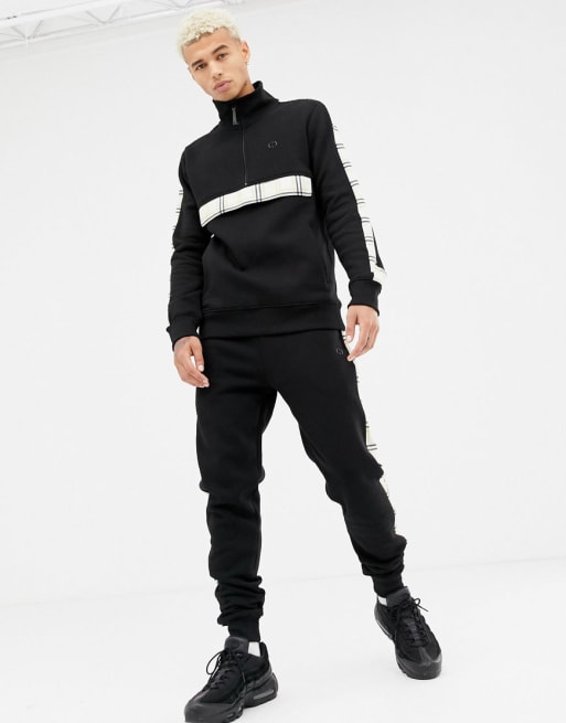 Criminal Damage tracksuit in black with check side stripe | ASOS