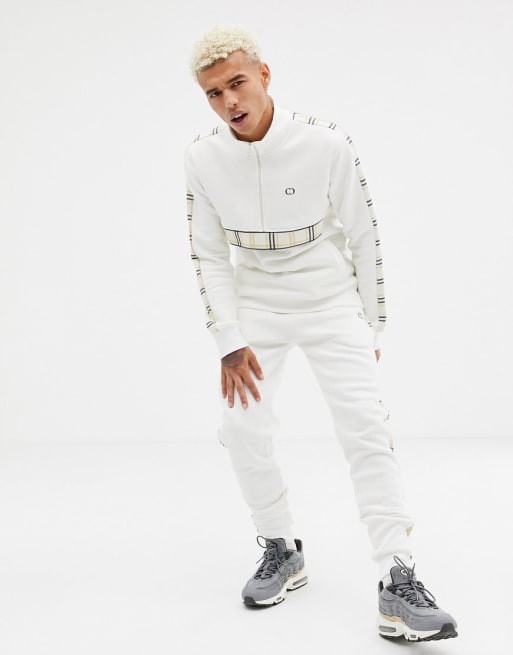 Criminal Damage tracksuit in white with check side stripe | ASOS