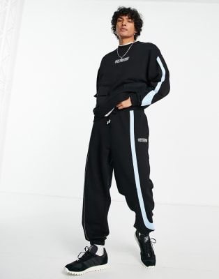 Crooked Tongues co-ord in black with pocket detailing
