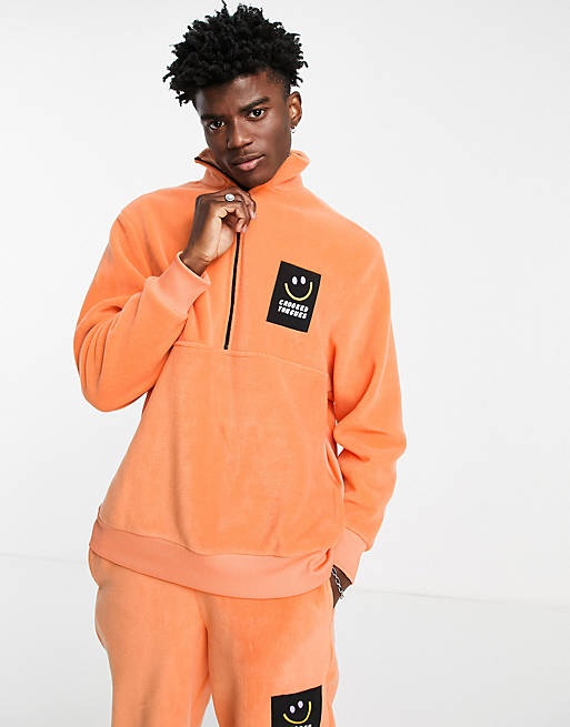 Crooked Tongues fleece co-ord in orange