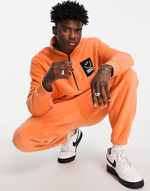 Crooked Tongues fleece co-ord with badge detail in orange