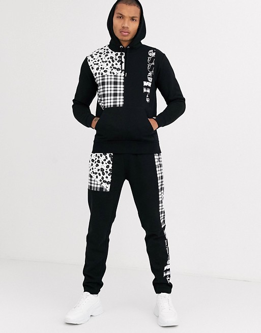 ellesse patchwork print sweatsuit in black exclusive at ASOS