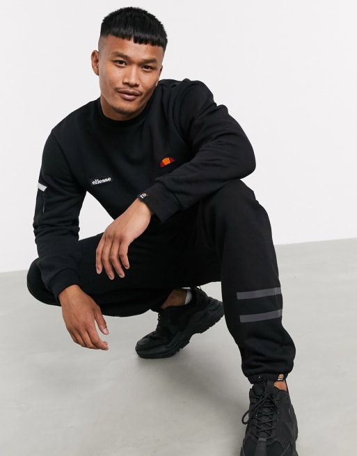 ellesse reflective sweatsuit in black exclusive at ASOS