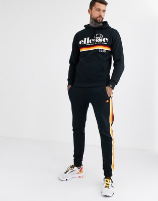 ellesse tracksuit with orange stripe in black ASOS